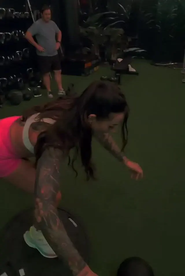 A client working through a balance exercise in Rob's gym session.